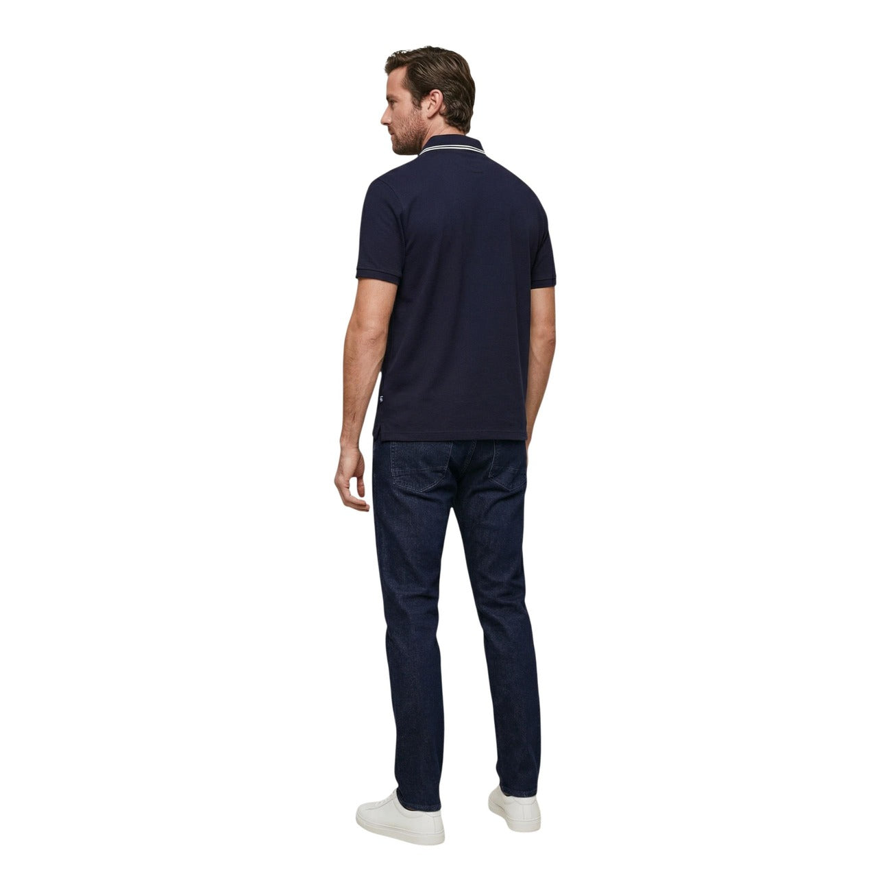 Back view of the navy polo shirt featuring short sleeves and logo on back against a white background.