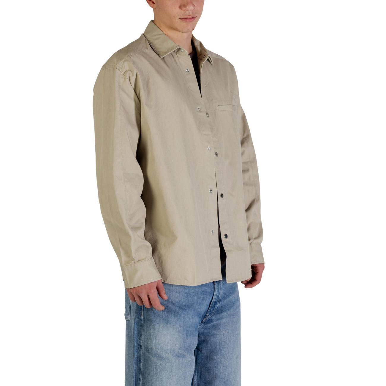 Side view of the beige blazer with button closure and long sleeves on a white background