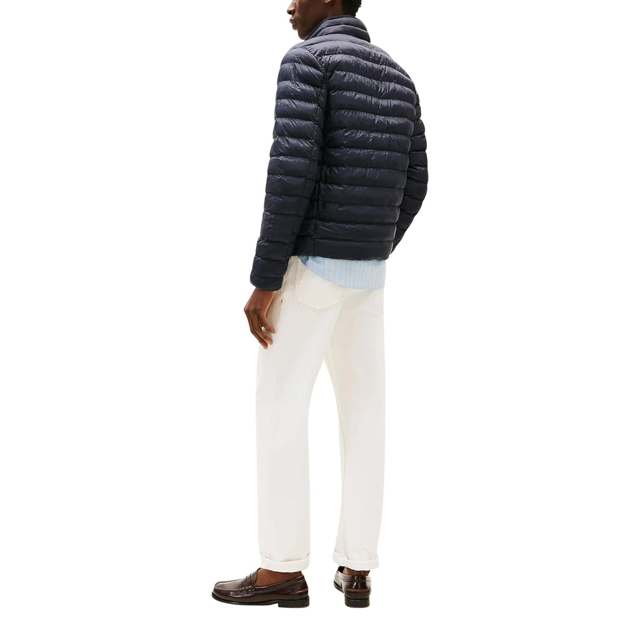 Back view of the navy puffer jacket showcasing the quilted design and collar on a white background.