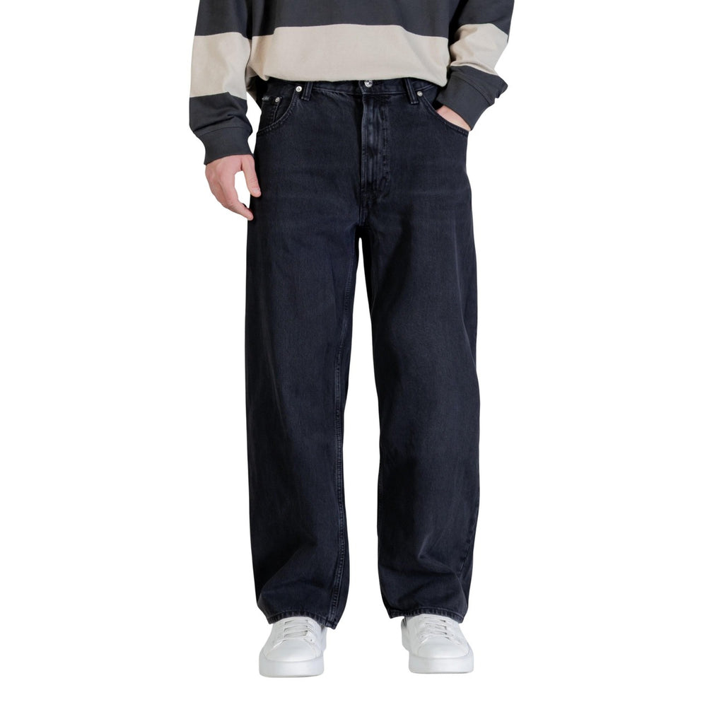 Back view of black wide leg jeans showcasing back pockets on a white background