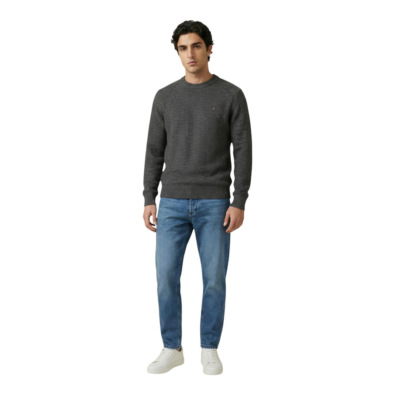 Lifestyle shot of a gray and blue sweater featuring long sleeves and crew neck on a white background.