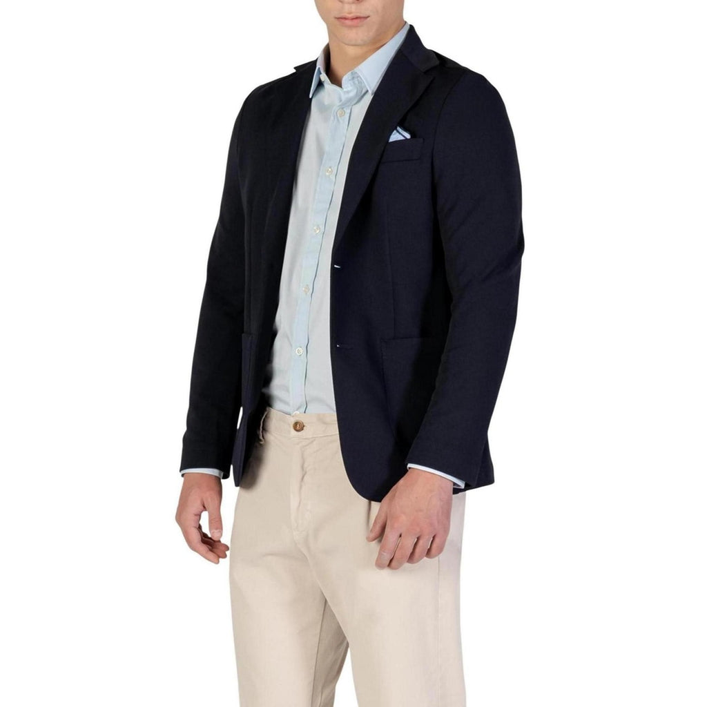 Side view of the navy blazer highlighting the notched lapel and chest pocket.