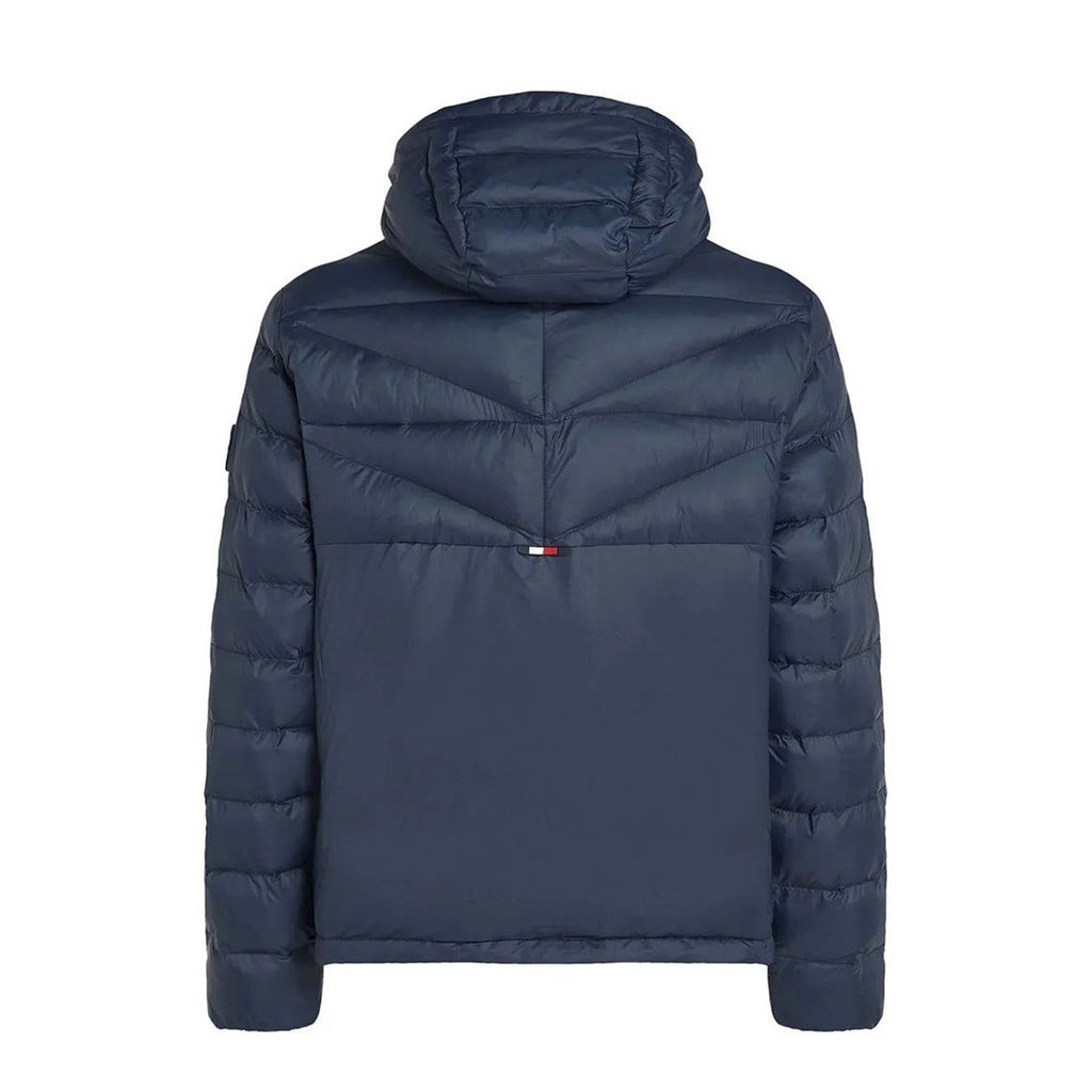 Back view of the navy puffer jacket showcasing the hood and quilted design on a white background.