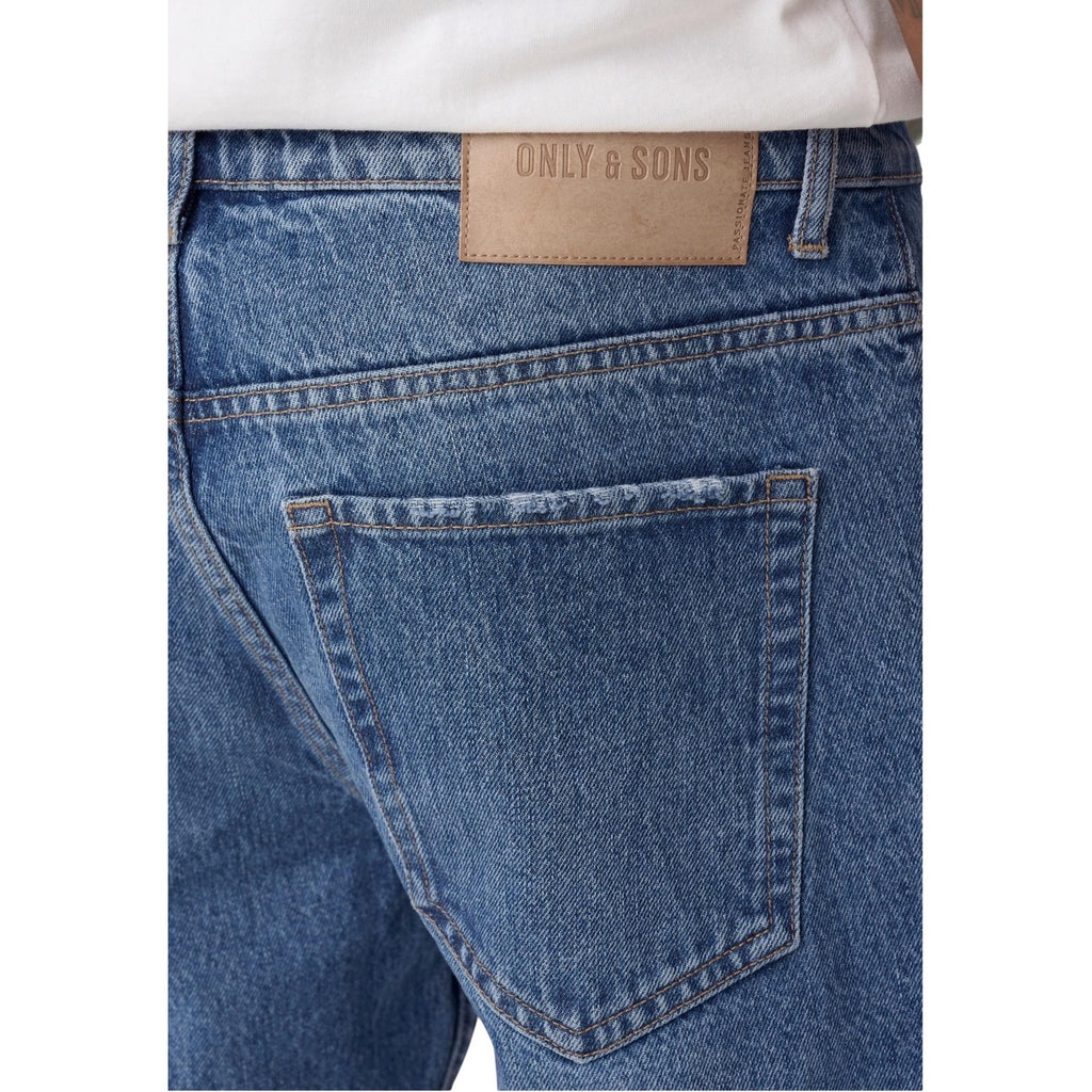 Close-up detail of light blue jeans showing back pocket and brand label on a white background