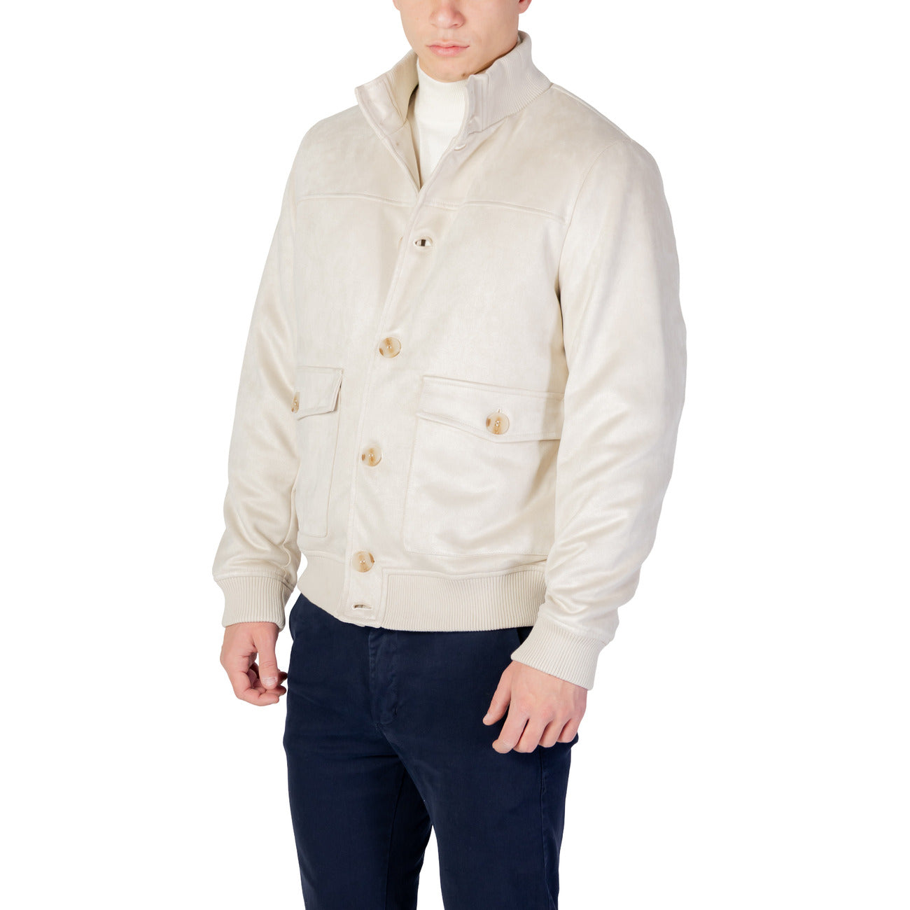 Side view of the light beige blazer highlighting button closure and quilted design.