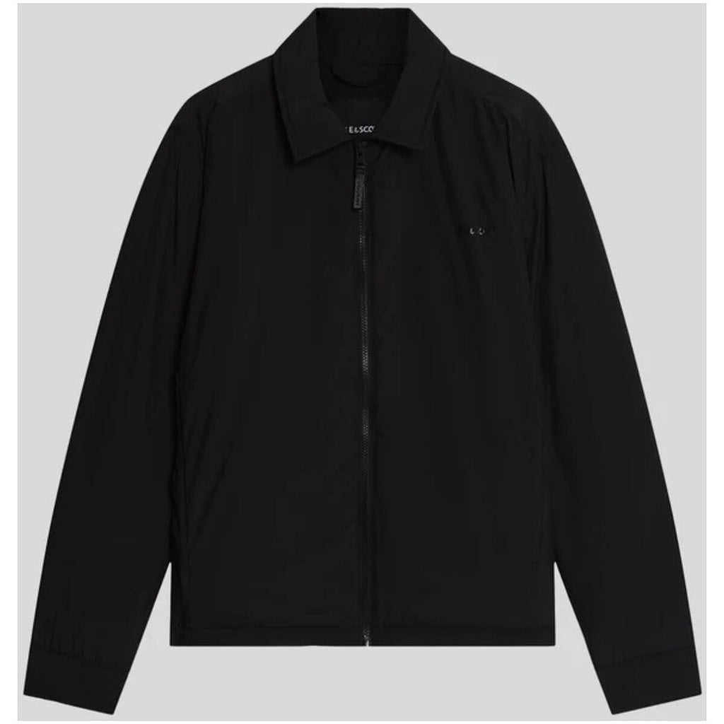 Detail close-up of the black blazer highlighting the zipper closure and collar.