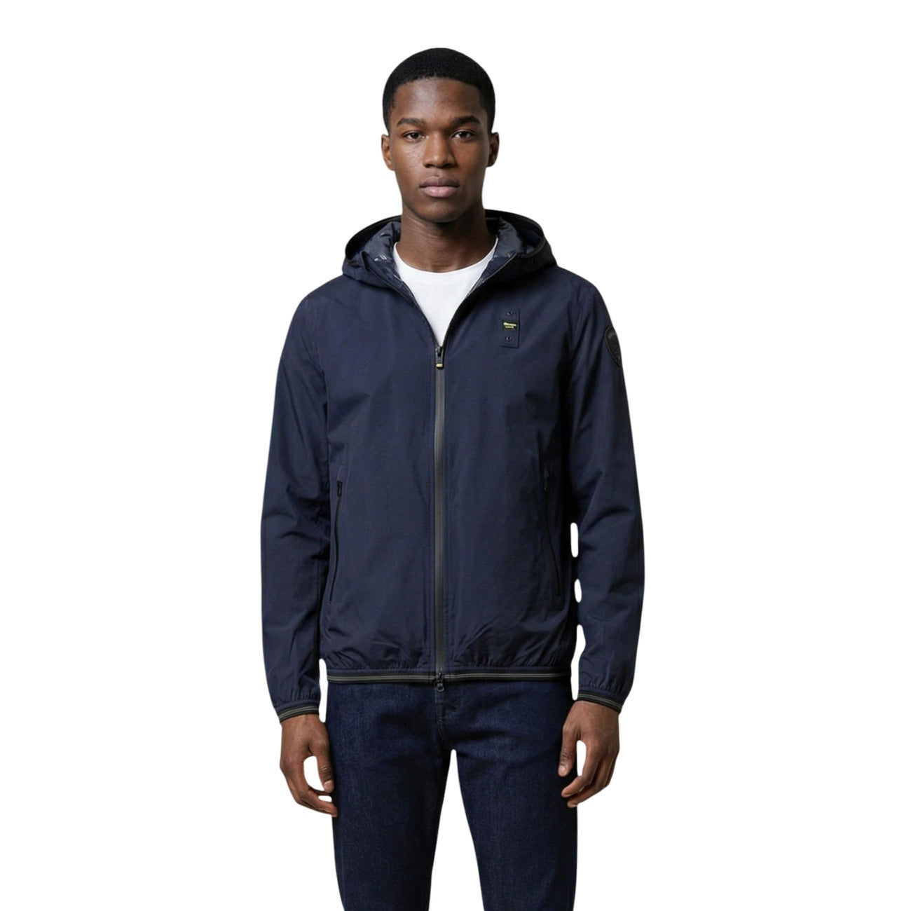 Front view of the blue blazer featuring a zipper closure and front pockets against a white background.