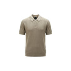 Detail close-up of the beige polo shirt highlighting the collar and plain design on a white background.