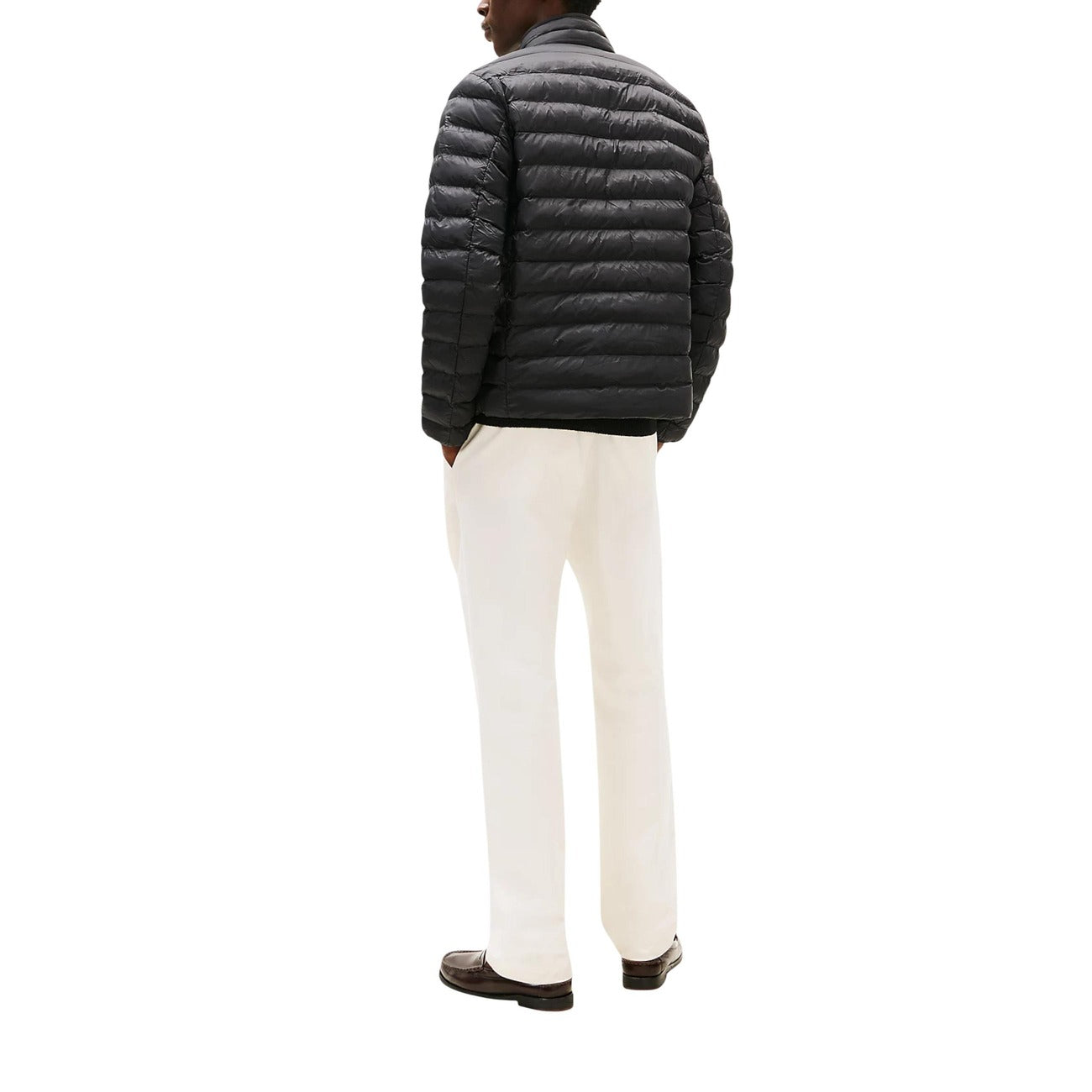 Back view of the black puffer jacket showcasing the zipper closure and quilted design.