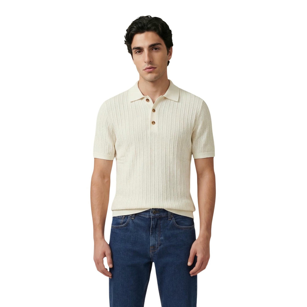 Front view of the beige polo shirt featuring short sleeves and a button placket.