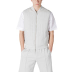 Front view of the light gray vest featuring a zipper closure and collarless design against a white background.
