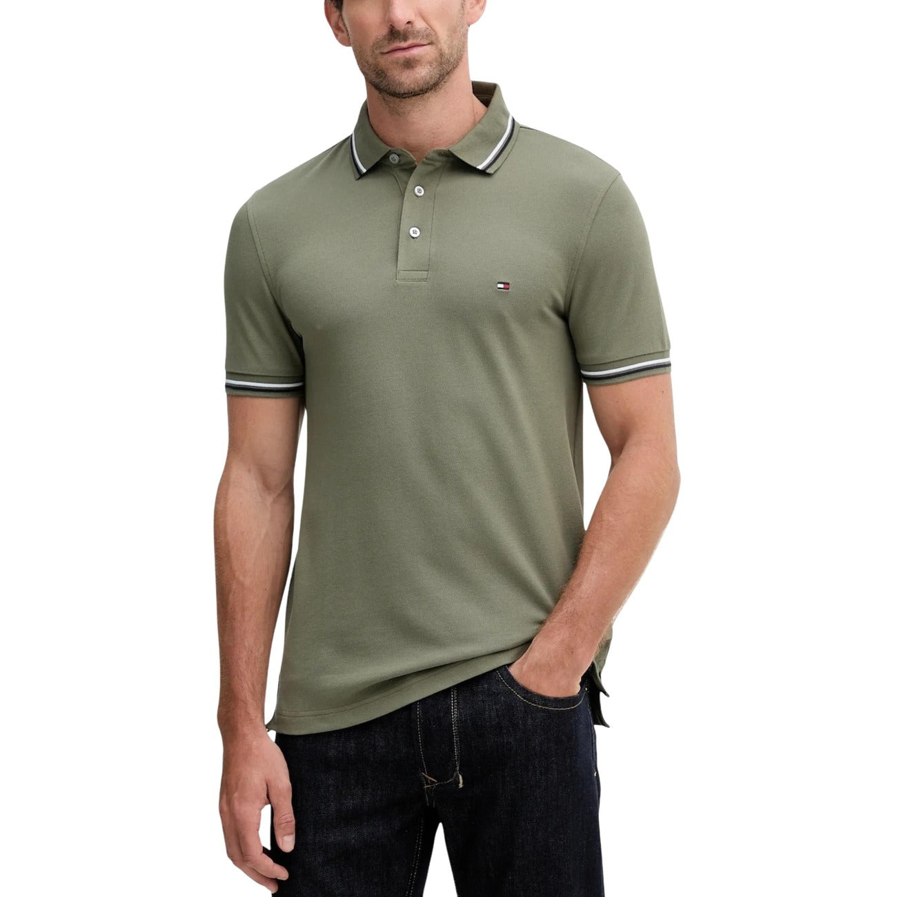 Lifestyle shot of a green polo shirt with short sleeves and button placket against a white background.