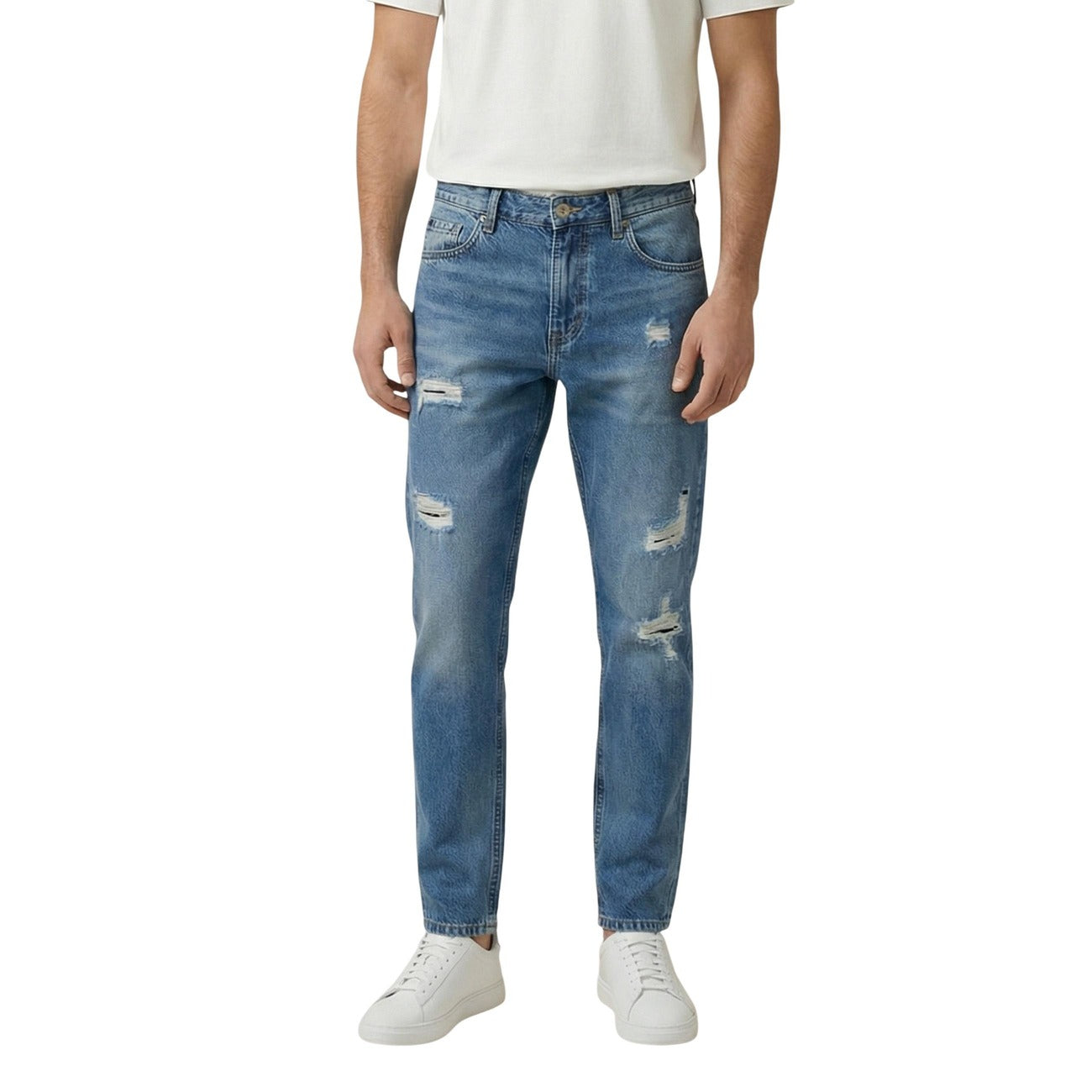 Lifestyle shot of distressed light blue jeans with a slim fit on a white background