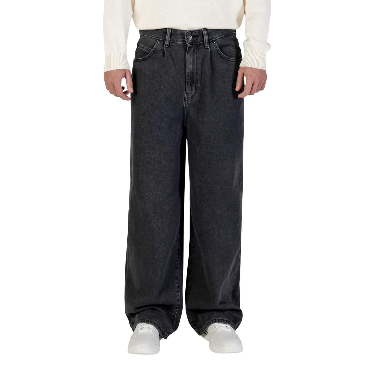 Lifestyle shot of black wide-leg pants featuring an elastic waistband and casual fit on a natural background