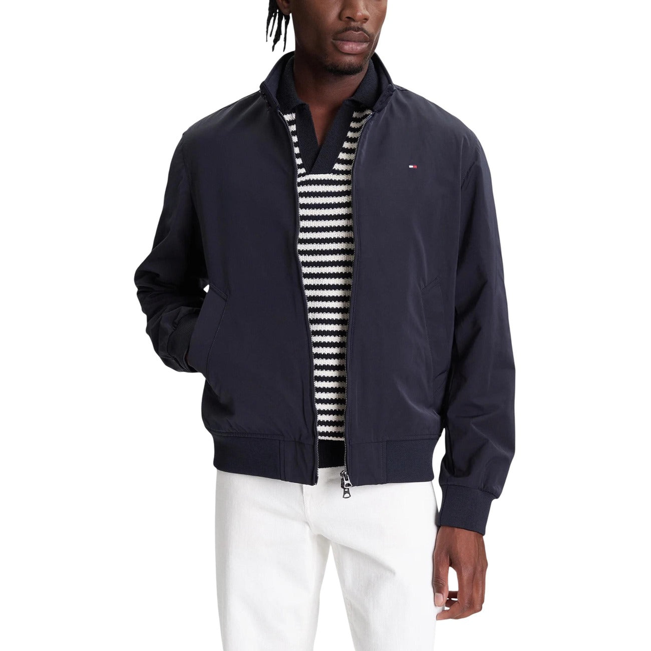 Front view of the navy blazer featuring zipper closure and pockets on a white background