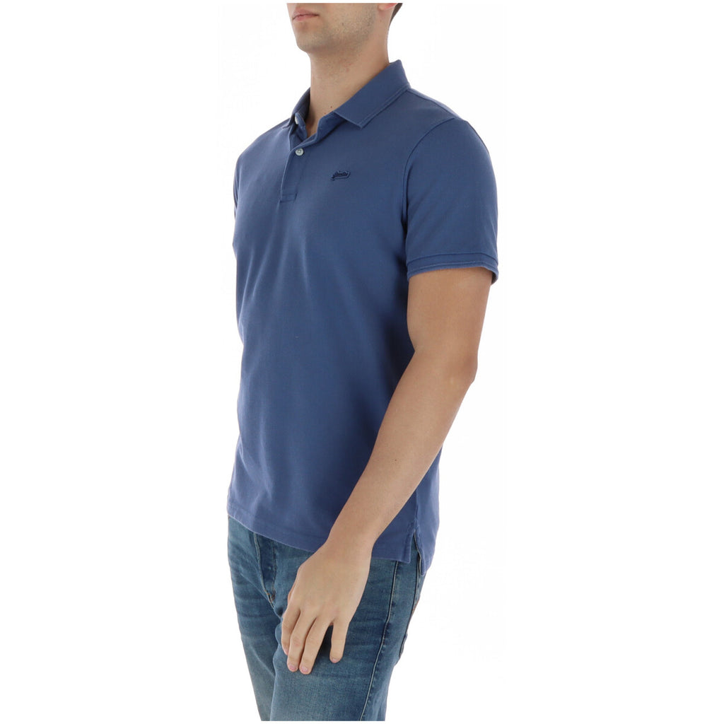 Side view of the blue polo shirt with short sleeves and a collar on a white background