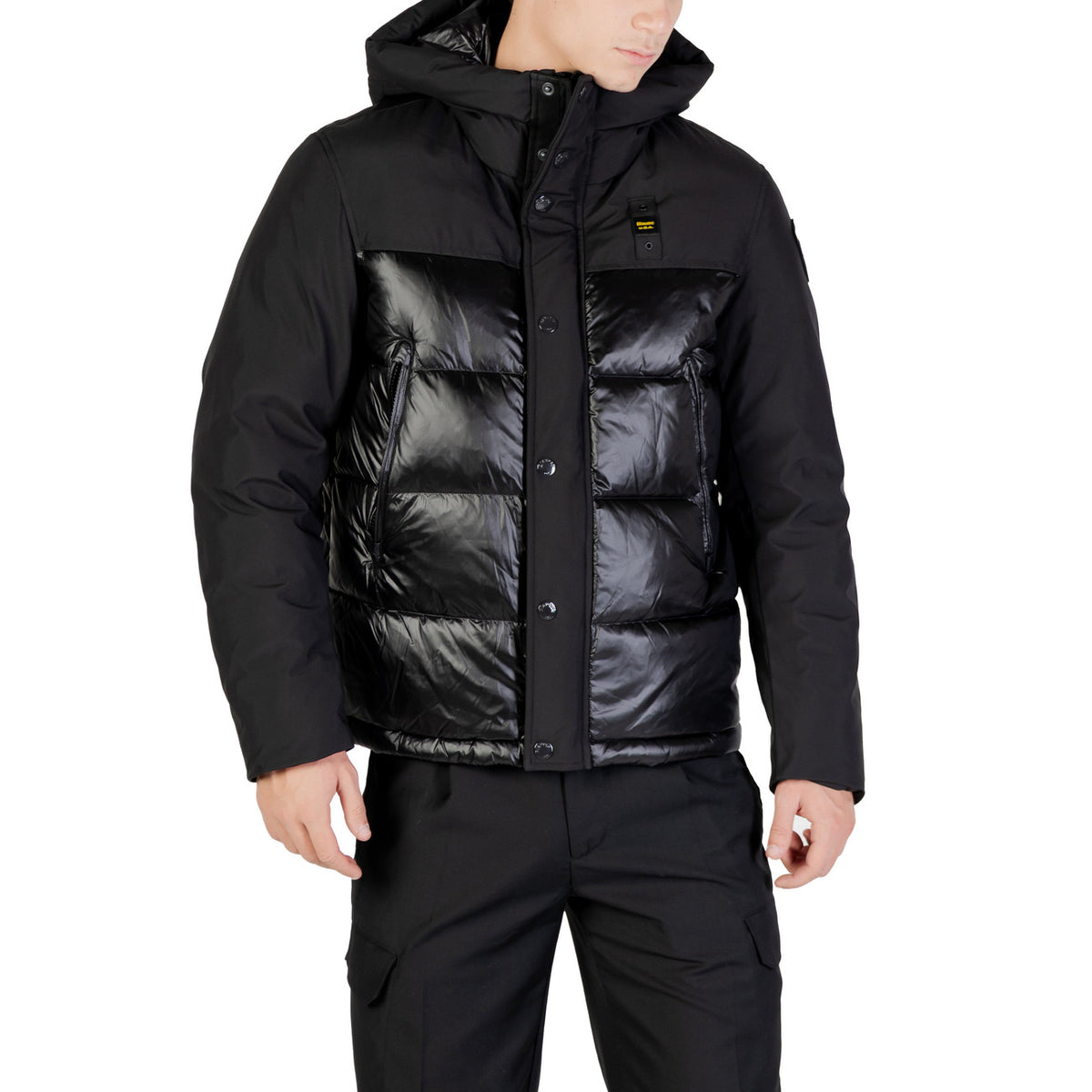 Front view of the black puffer jacket featuring a zipper closure and hood on a white background.