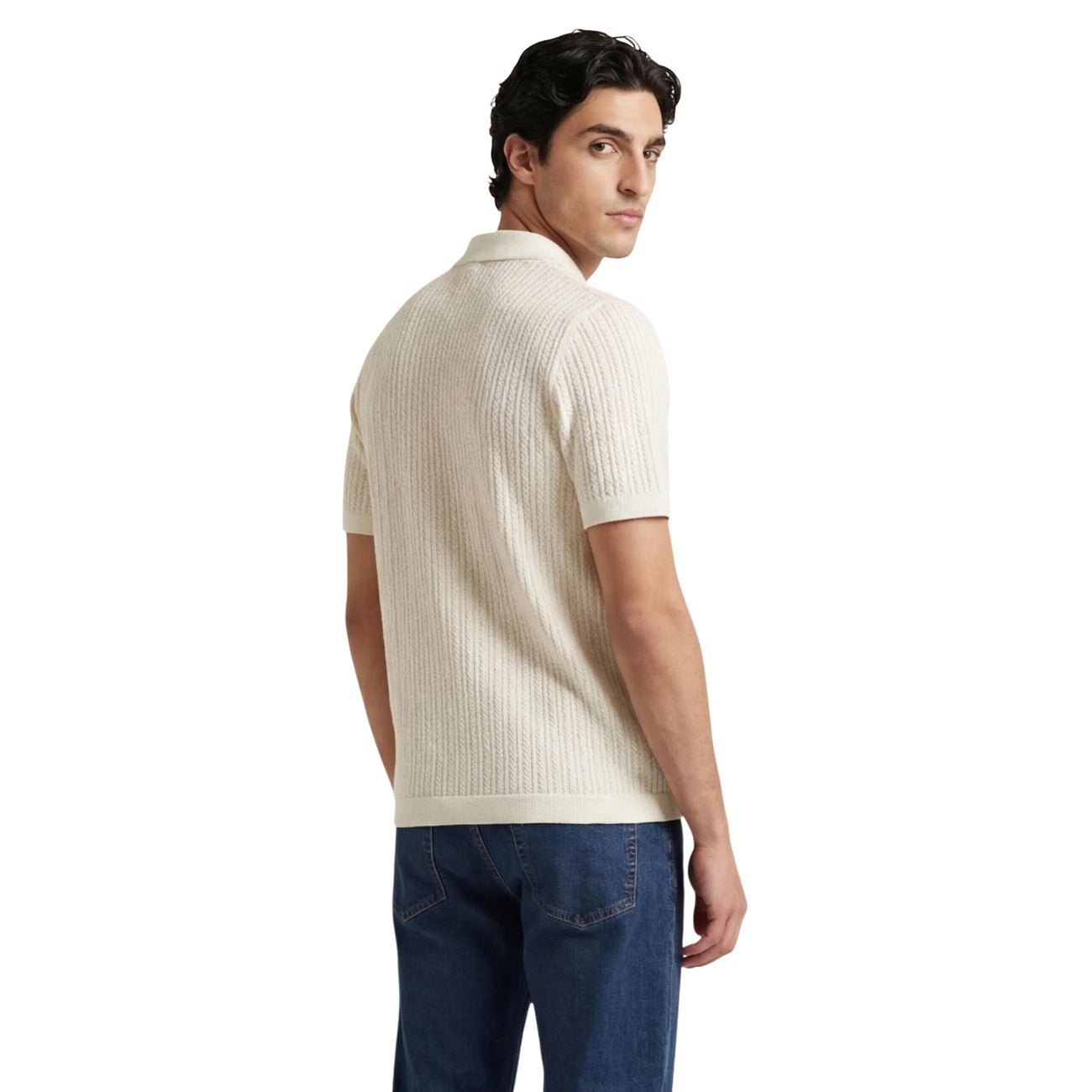 Back view of the beige polo shirt showcasing short sleeves and collar.