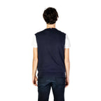 Back view of the navy sleeveless gilet showcasing the v-neck design on a white background.