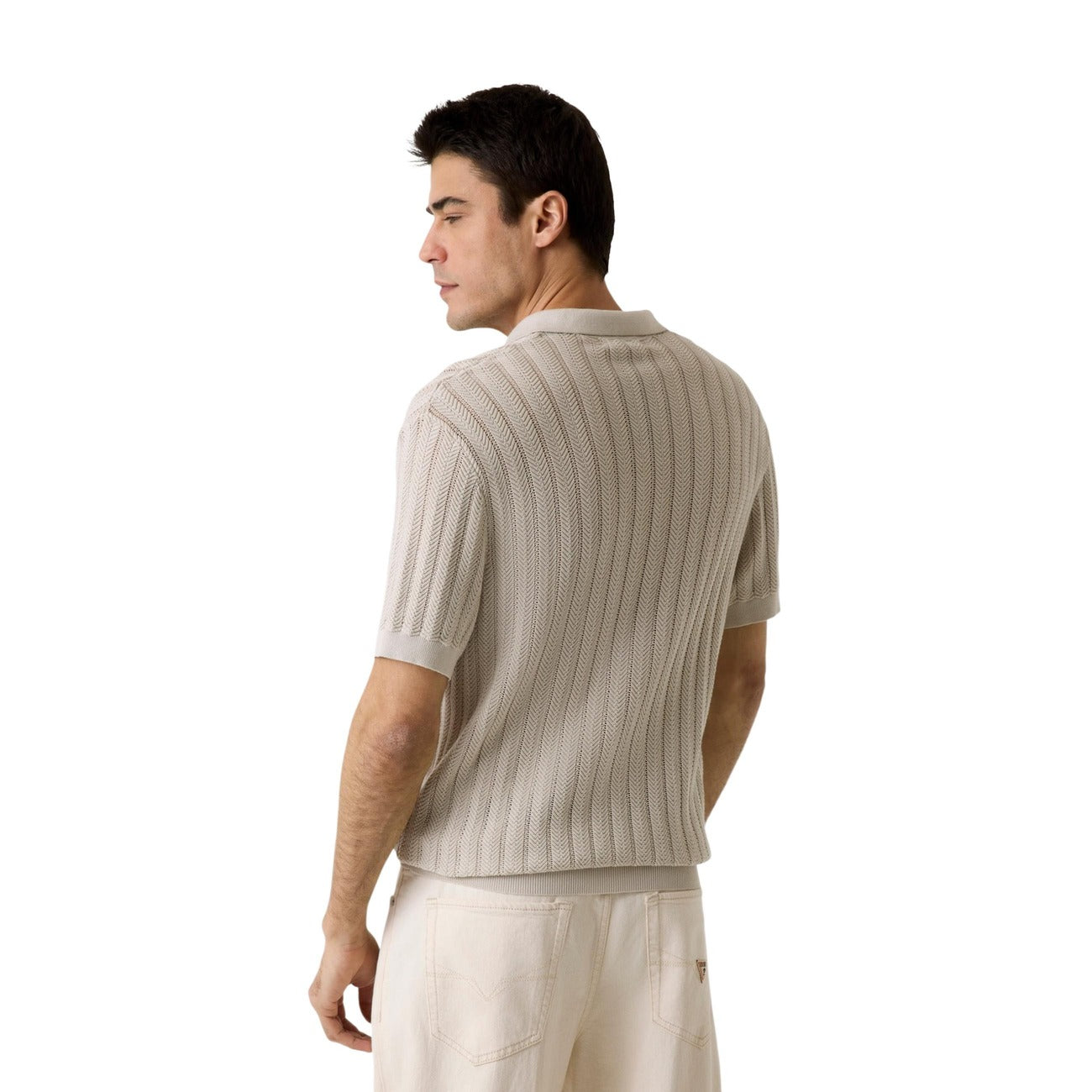Back view of a beige polo shirt featuring short sleeves and collar on a white background.