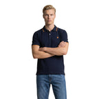 Front view of the navy polo shirt featuring a collar and short sleeves on a white background.