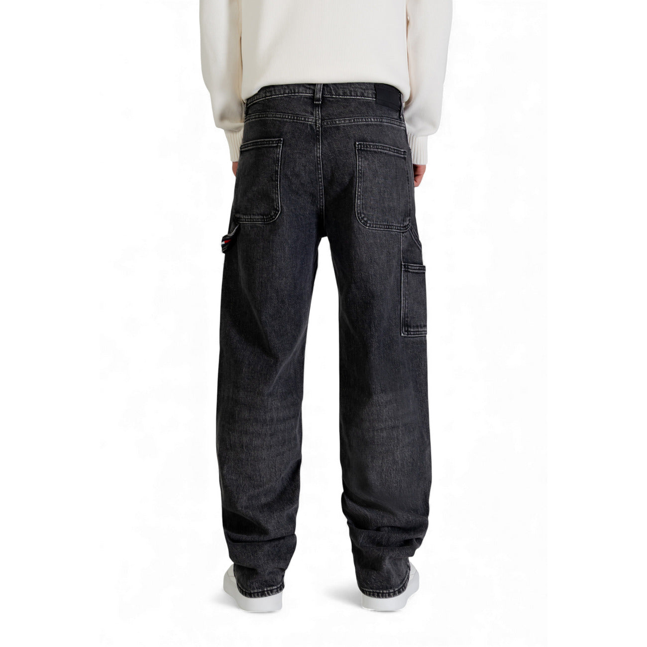 Back view of dark blue loose fit denim pants featuring five pockets.