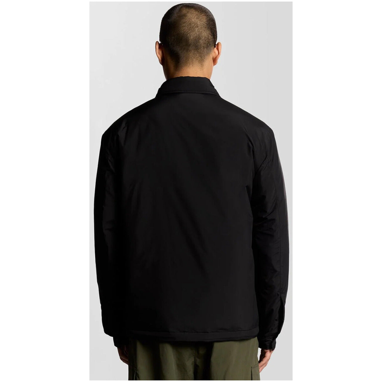 Back view of the black blazer showcasing the collar and no visible closure.