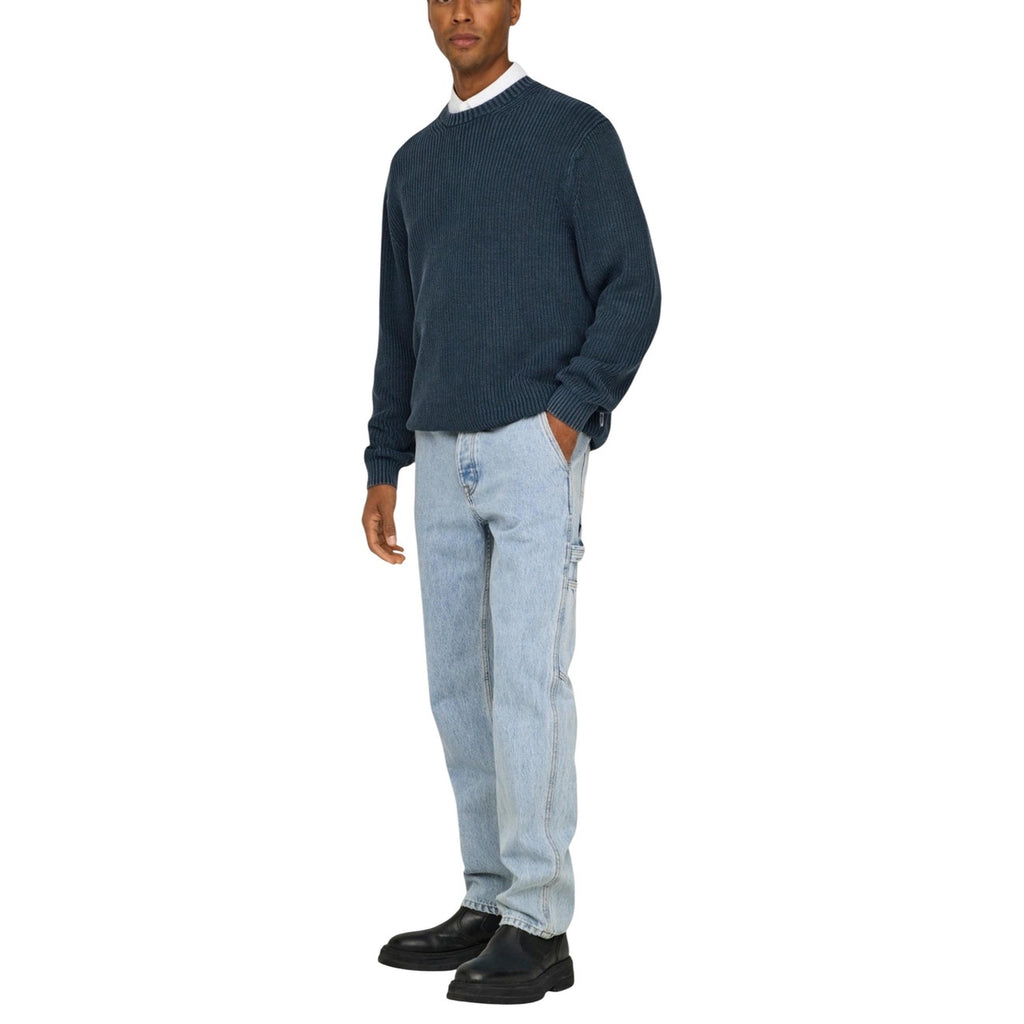 Front view of light blue slim fit jeans showcasing five pockets on a white background