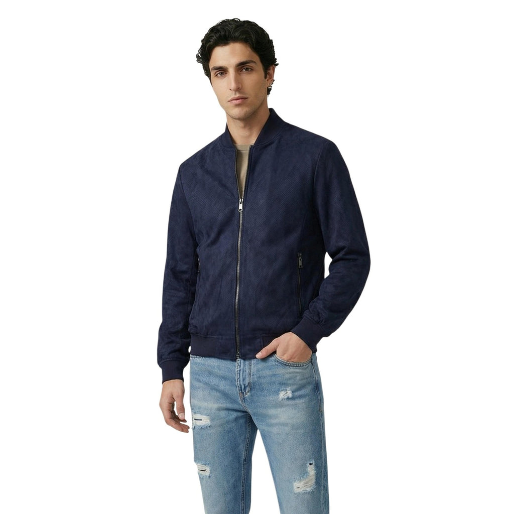 Lifestyle shot of a man in a blue denim jacket with zipper closure against a white background.