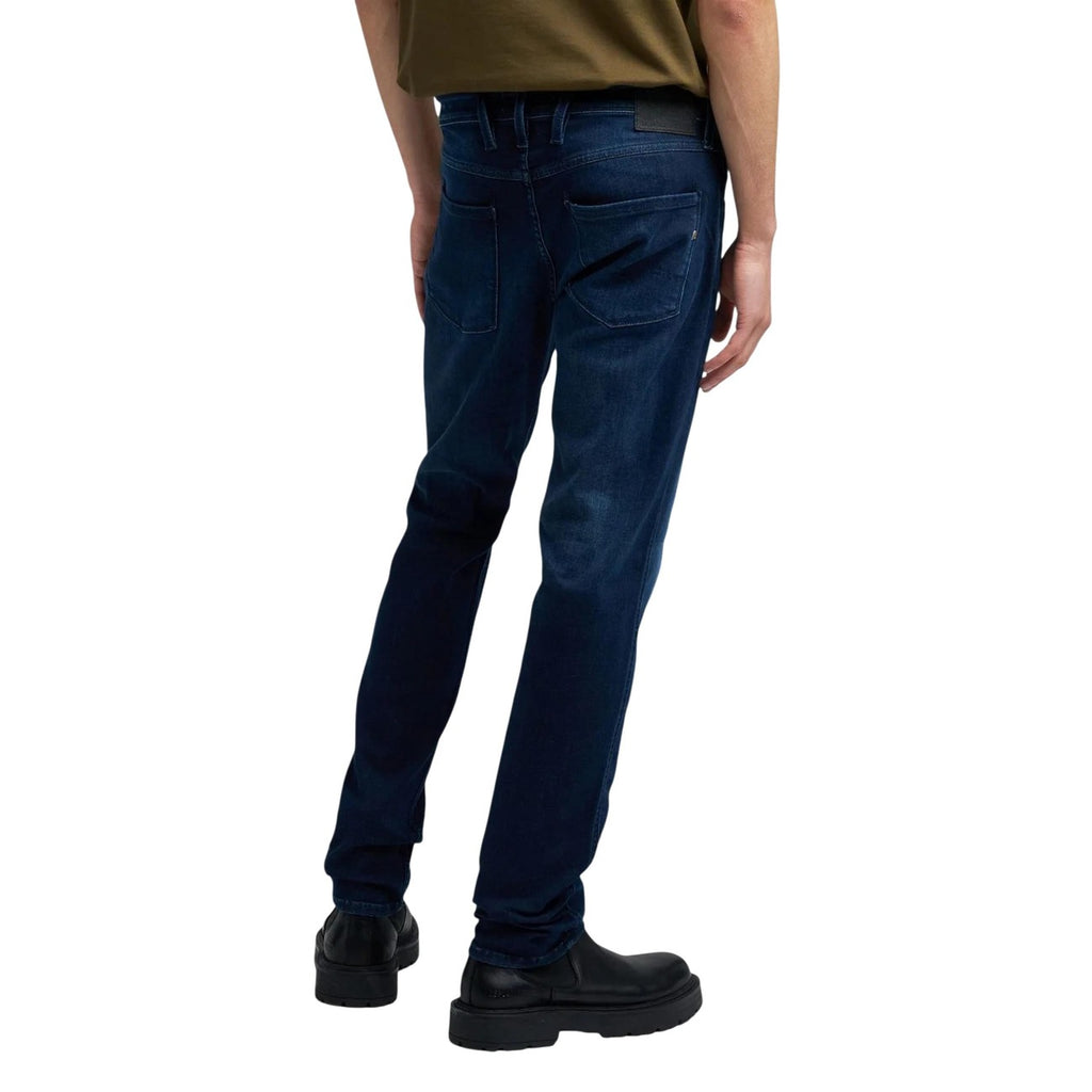 Back view of blue slim fit jeans showcasing five pockets on a white background