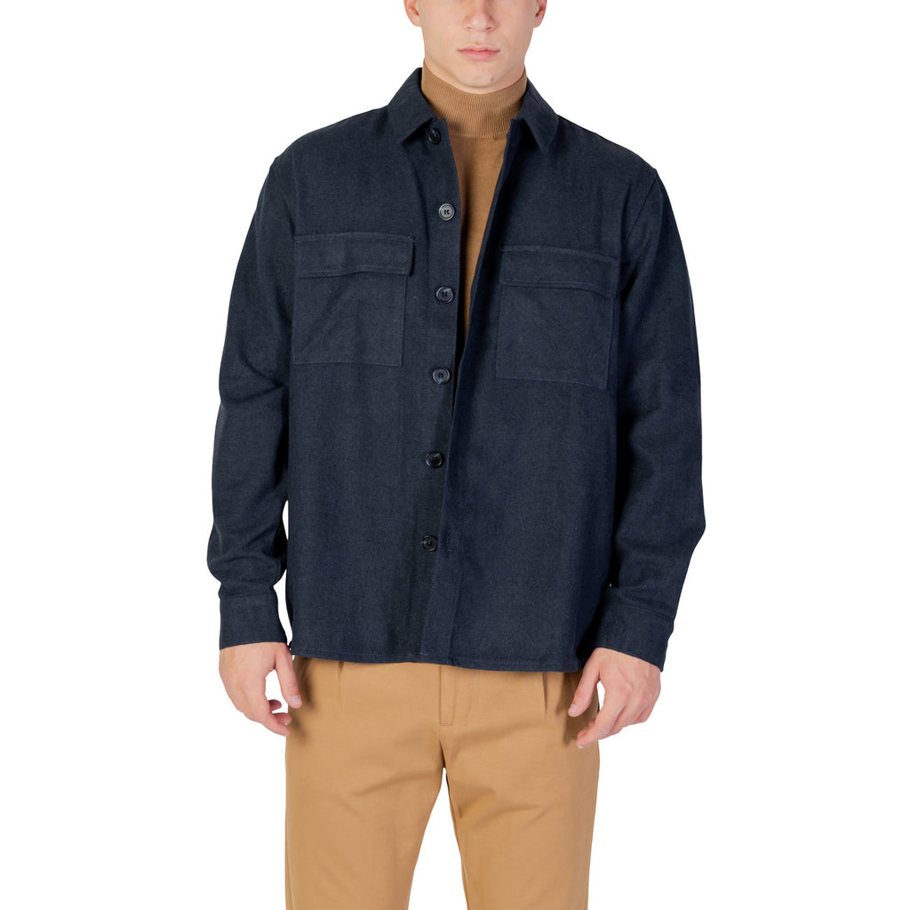 Lifestyle shot of a navy blazer featuring a collared design against a white background.