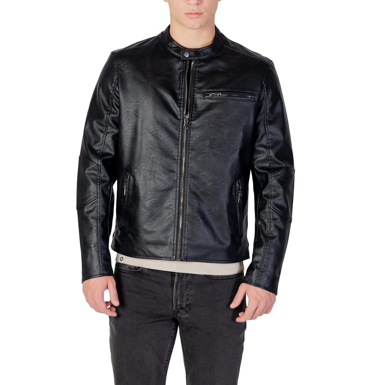 Front view of the black blazer featuring a zipper closure and long sleeves against a white background.