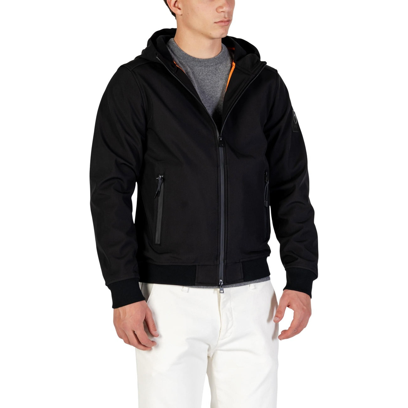 Lifestyle view of a black hoodie blazer showcasing the zipper closure and front pockets.