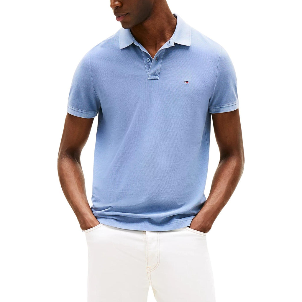 Front view of the blue polo shirt featuring short sleeves and a collar on a white background.