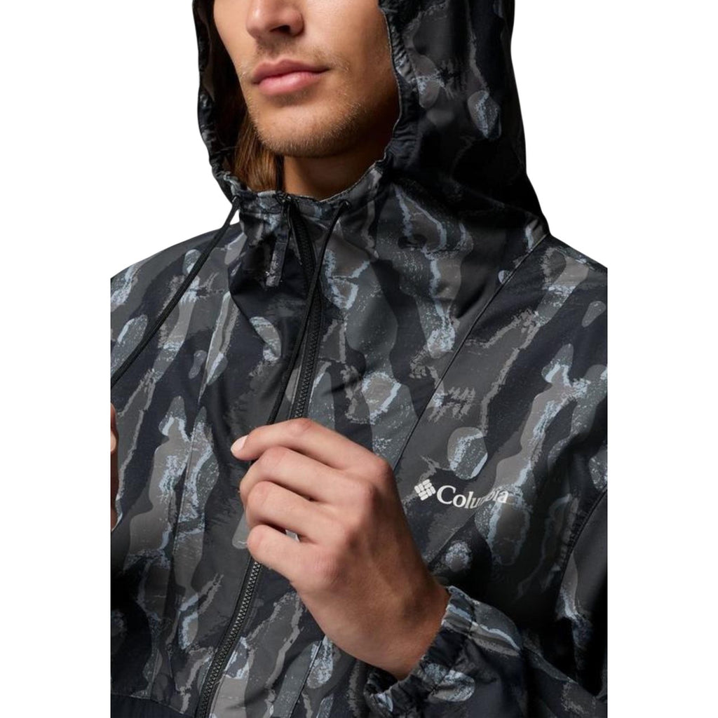Detail close-up of the zipper on a men's black camouflage blazer with a hood on a white background.