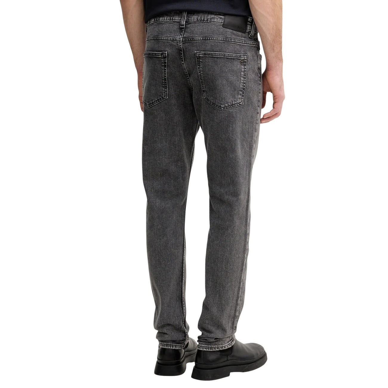 Lifestyle shot of a man wearing a bomber jacket with gray jeans, casual style on a white background