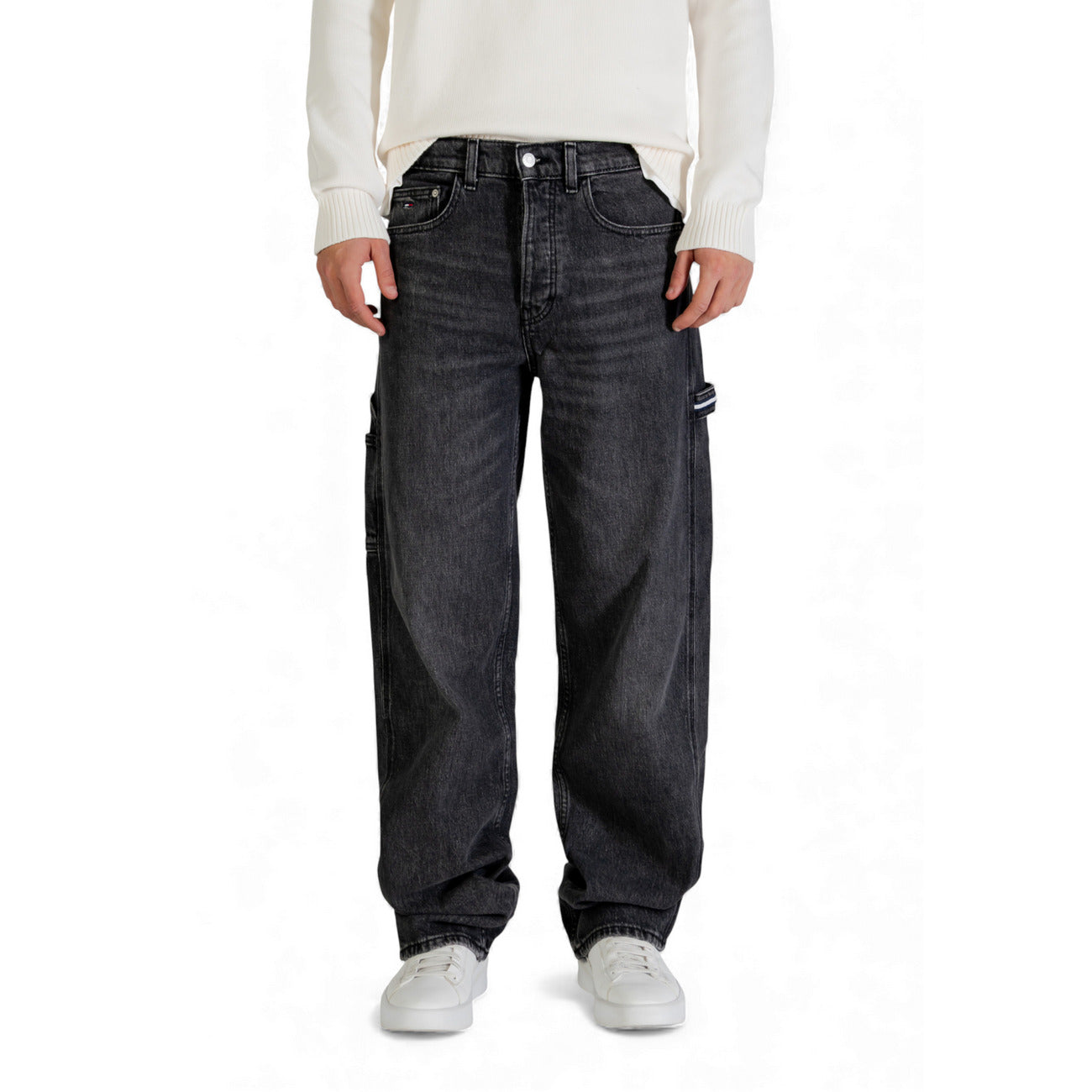 Front view of dark blue loose fit denim pants with five pockets.