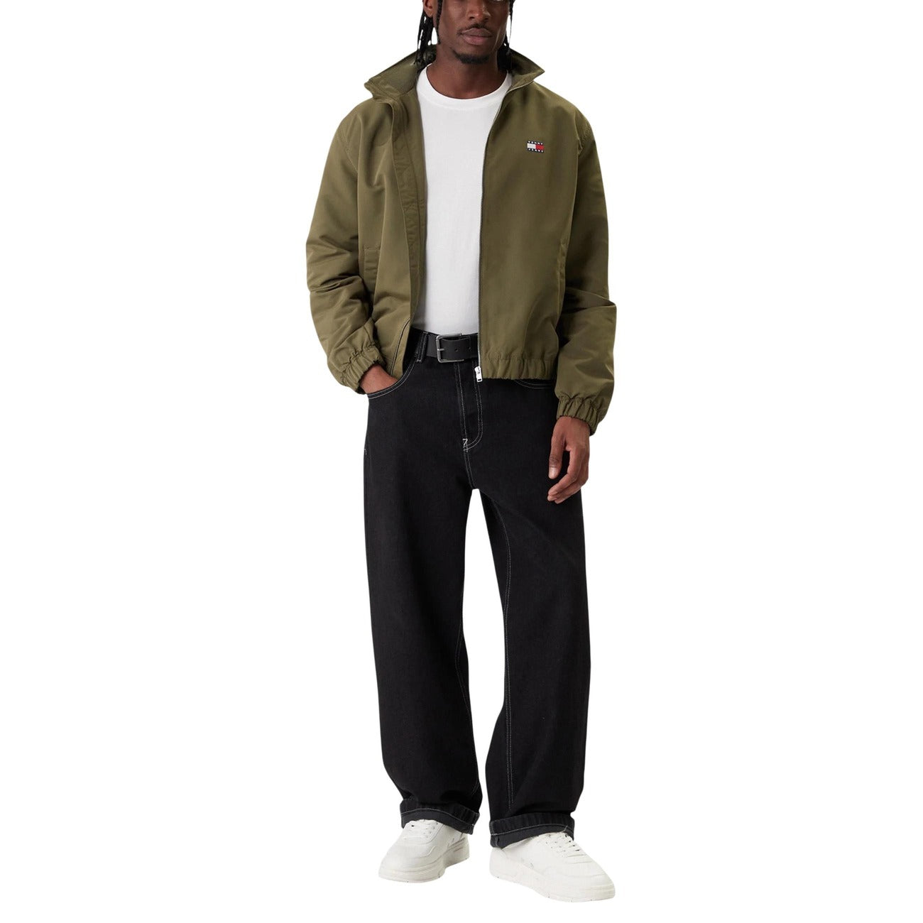 Back view of the olive green jacket showcasing its casual style in a studio setting.