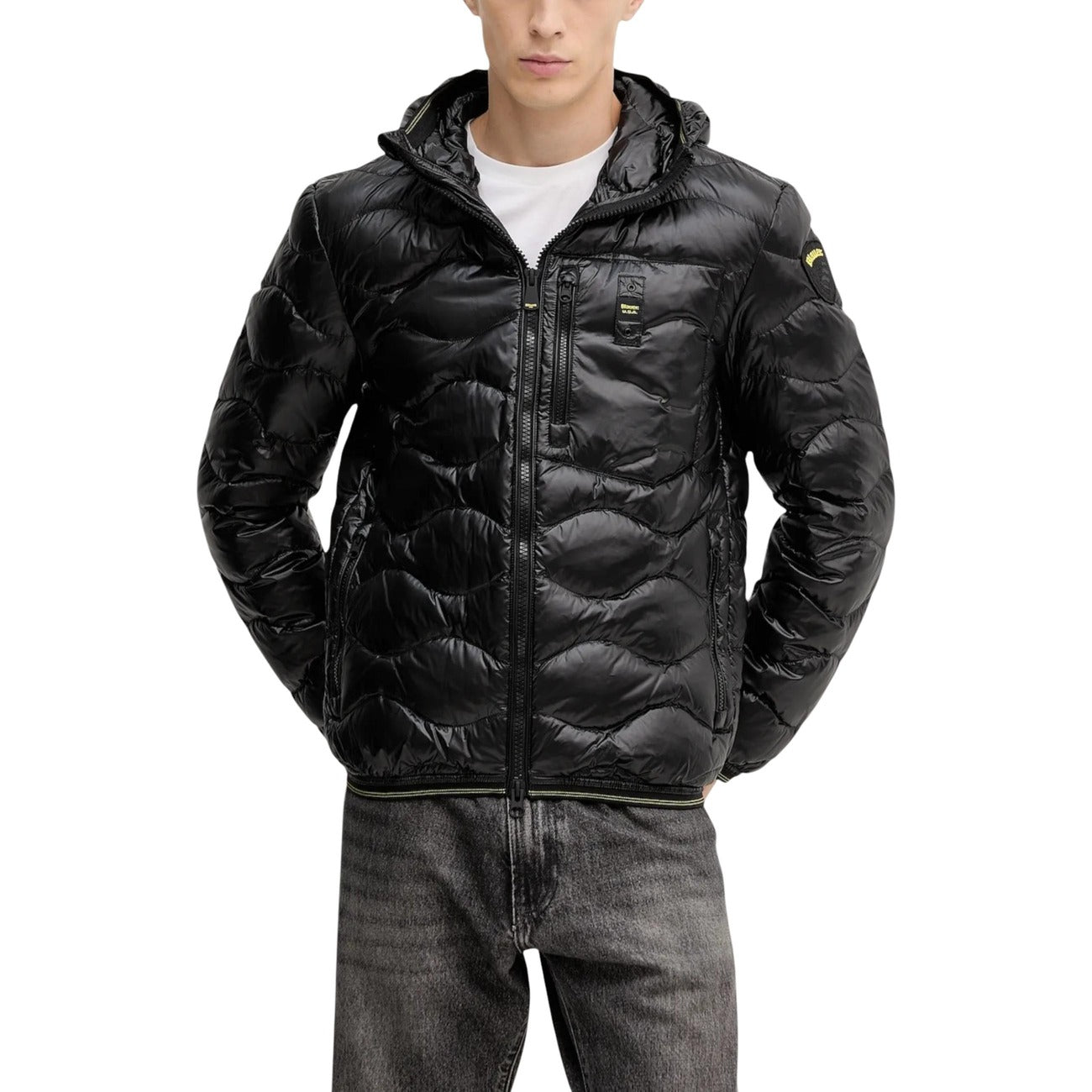 Front view of the black puffer jacket with zipper closure and hood in a studio setting.