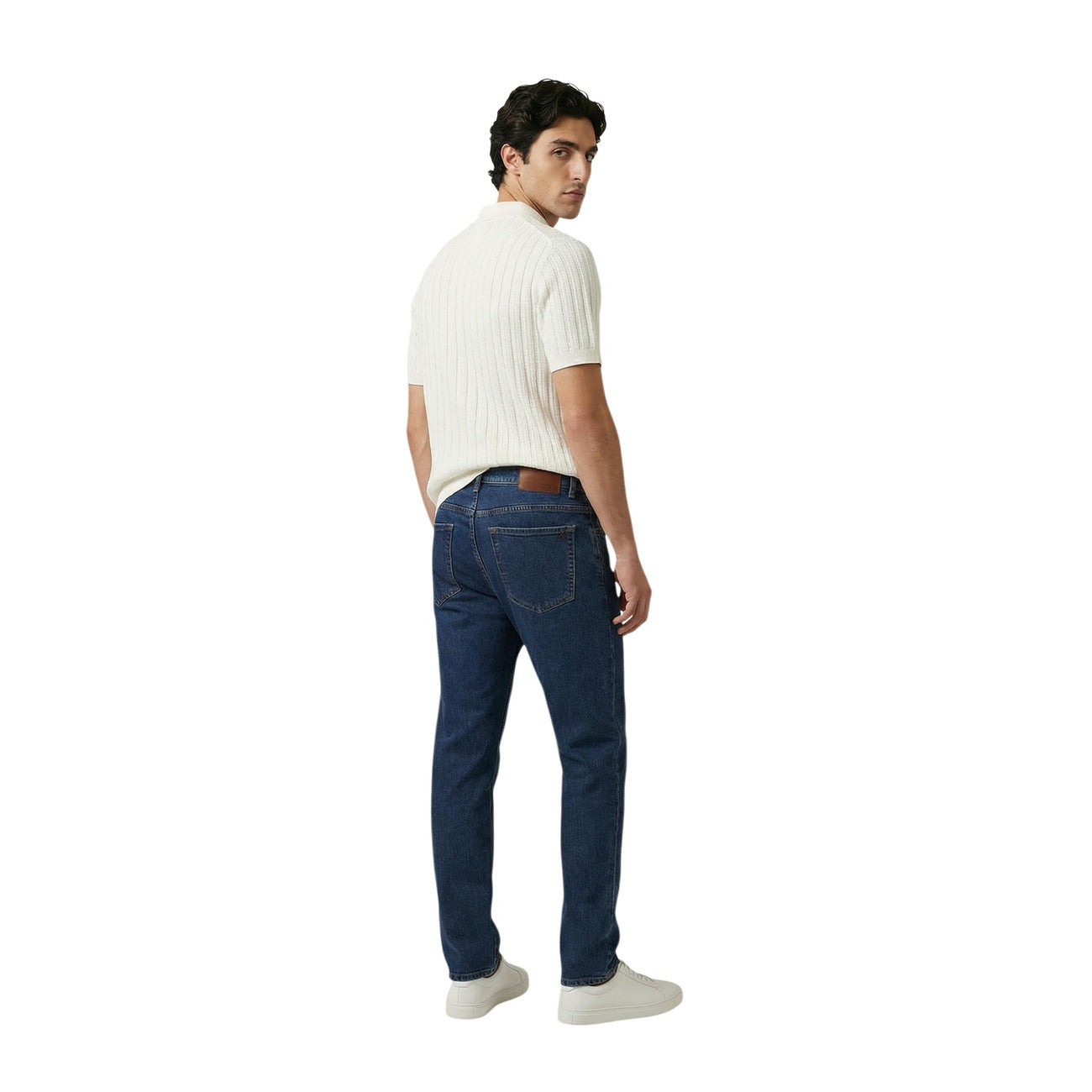 Front view of a cream polo shirt with short sleeves and a collar against a white background.