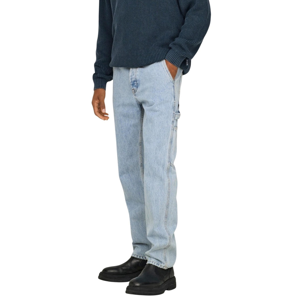 Side view of light blue slim fit jeans featuring five pockets on a white background