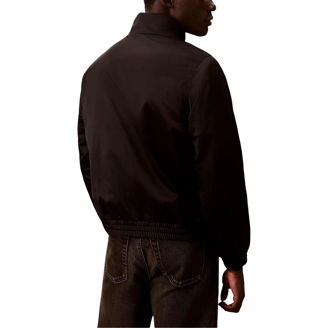 Back view of the black Calvin Klein Jeans blazer with a high collar and zipper closure.