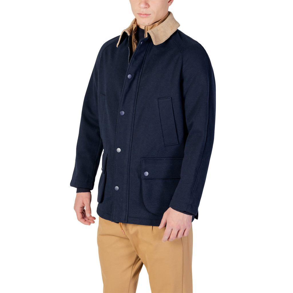 Side view of the navy blazer with button closure and pockets on a white background