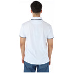 Back view of the white polo shirt featuring short sleeves.