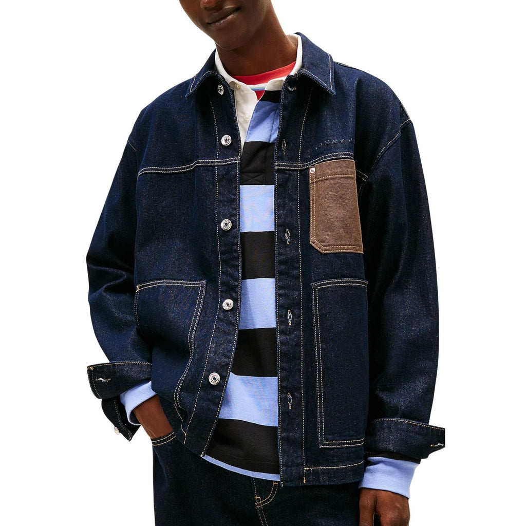 Lifestyle shot of a person wearing a blue denim jacket with a layered outfit.