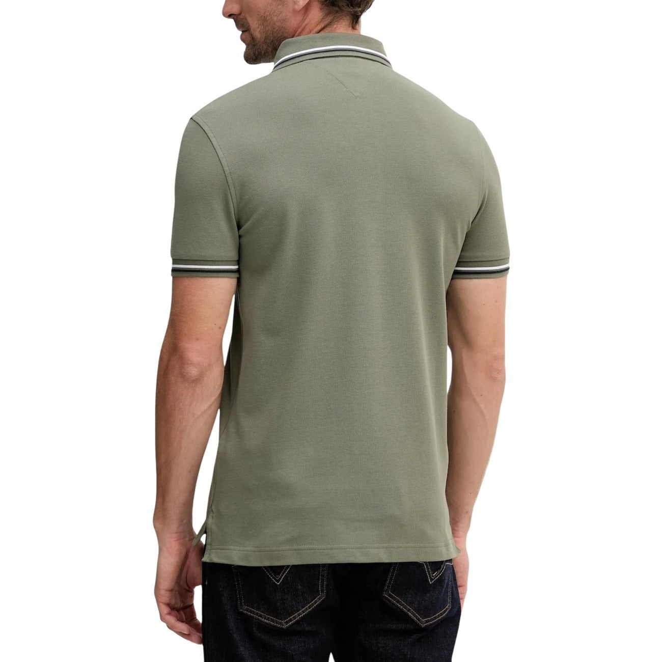 Back view of a green polo shirt featuring short sleeves and a button placket on a white background.