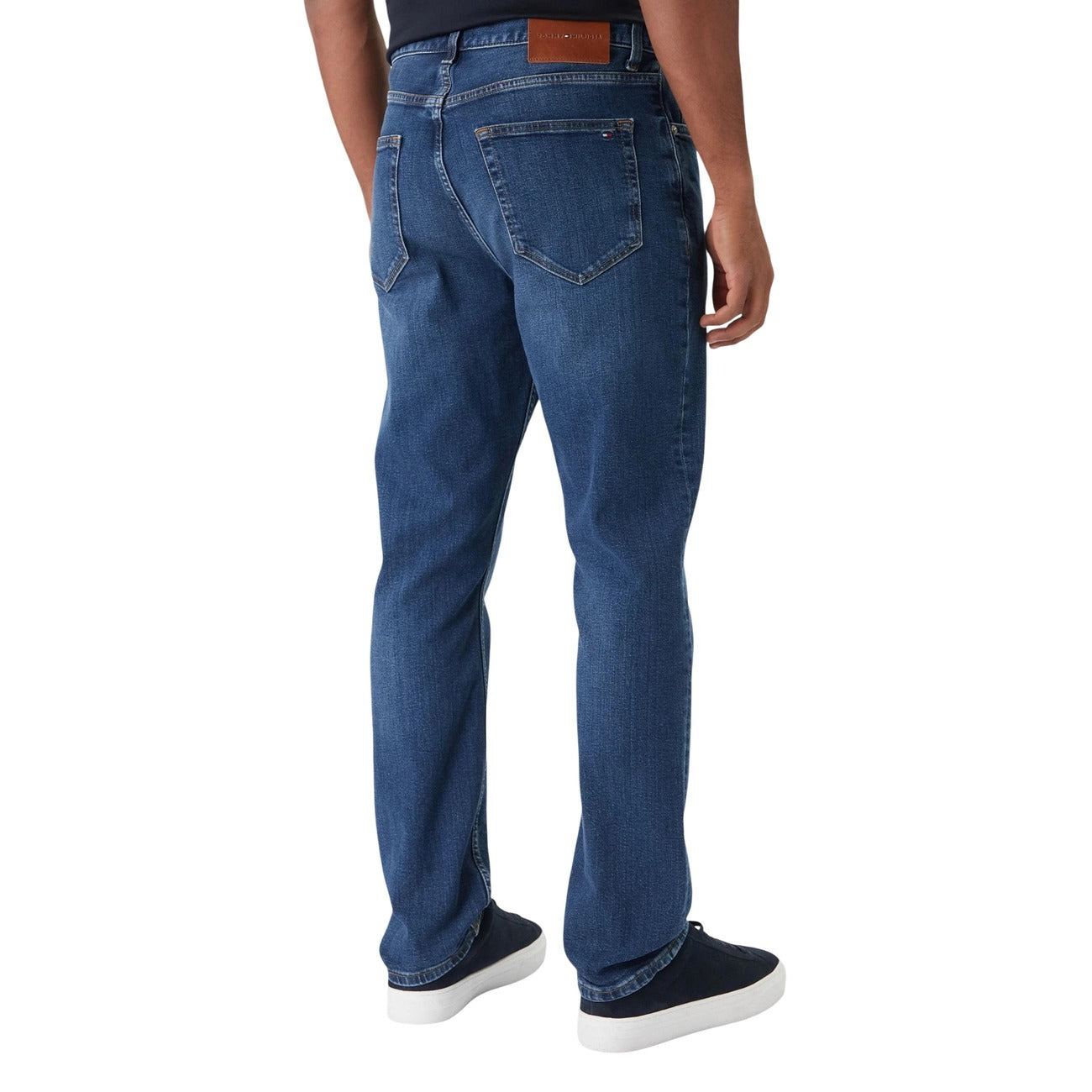 Lifestyle shot of blue jeans paired with a gray sweater, showcasing a casual style.