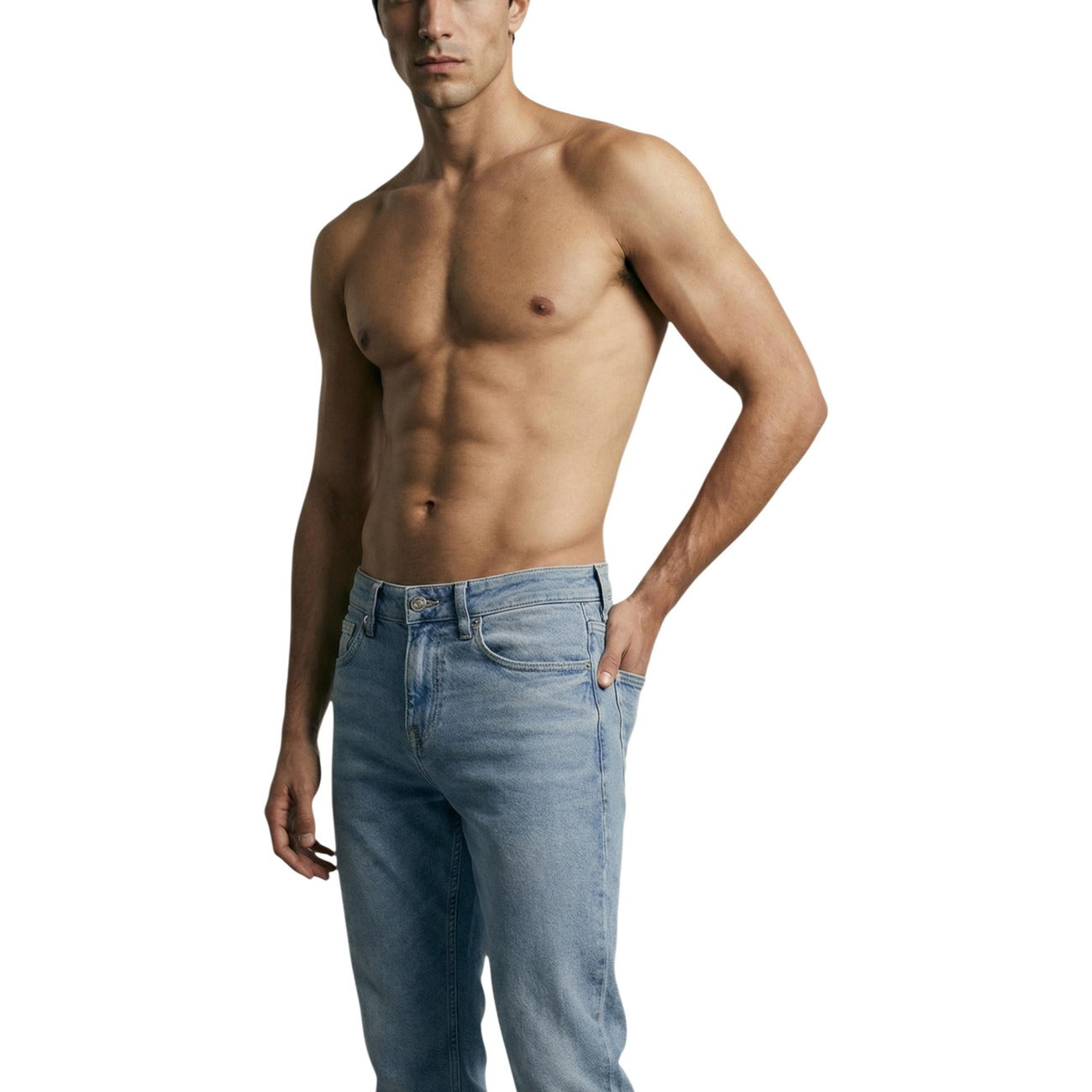 Lifestyle shot of a model wearing light blue skinny fit jeans in a casual style on a white background