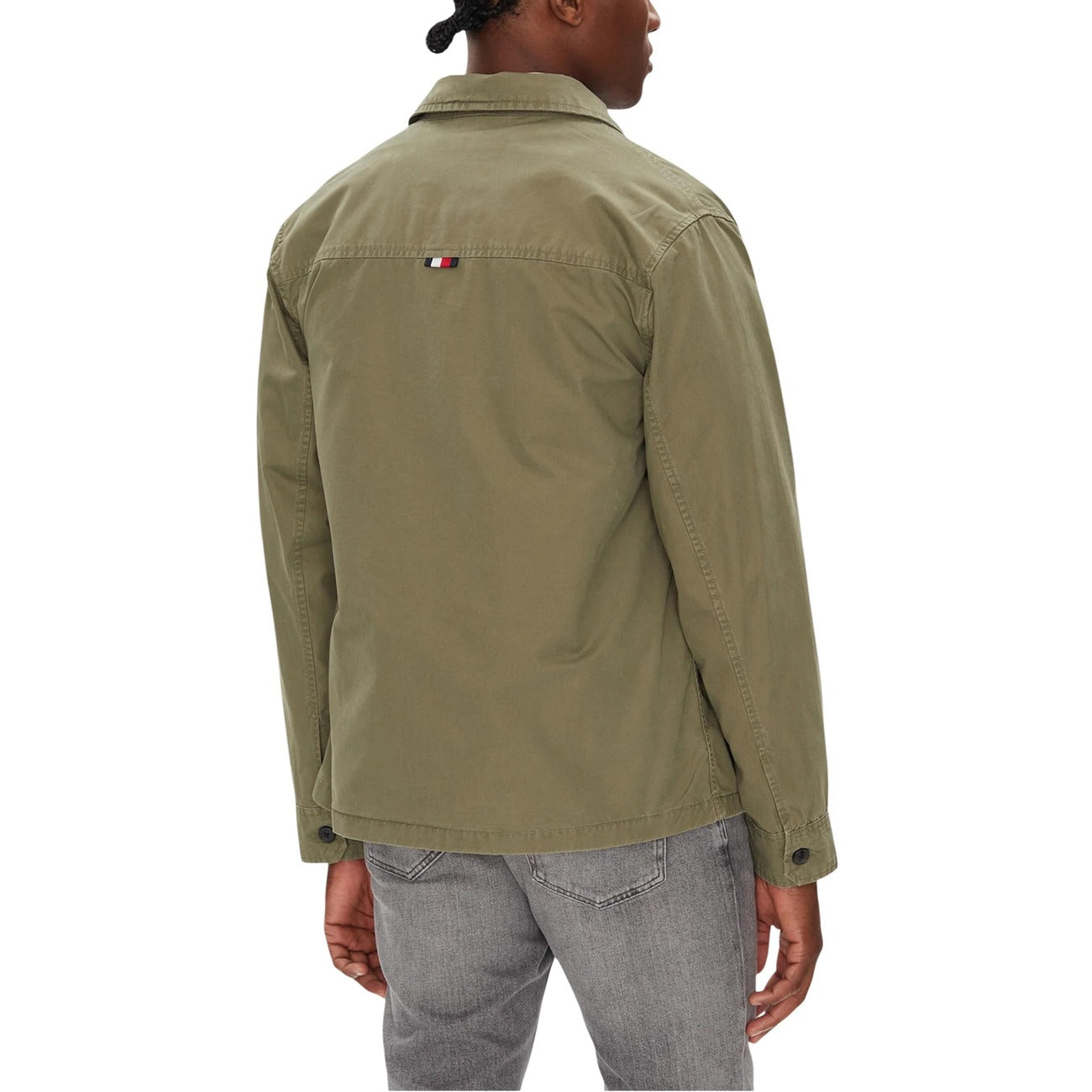 Back view of the green blazer showcasing its casual fit and back design.