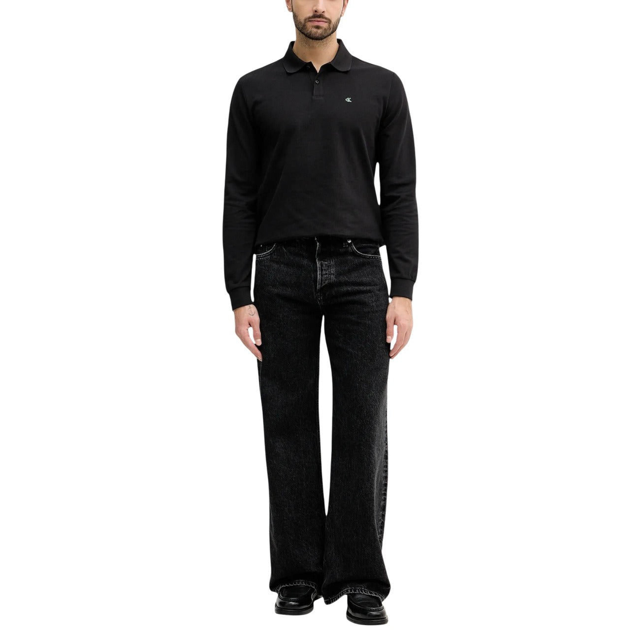 Back view of the black long-sleeve polo showcasing its collared style and button placket.